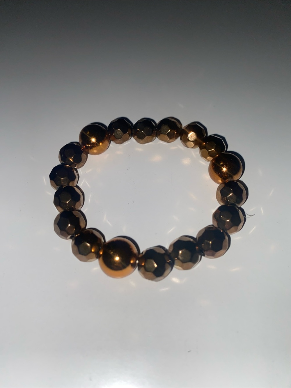 Faceted and Smooth Metallic Bead Stretch Bracelet - Bronze Tone